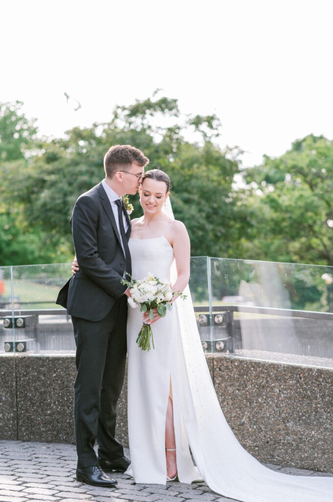 Bride and groom portrait near the Rideau Canal in downtown Ottawa, steps from the Fairmont Château Laurier — photographed by Emma Haidar