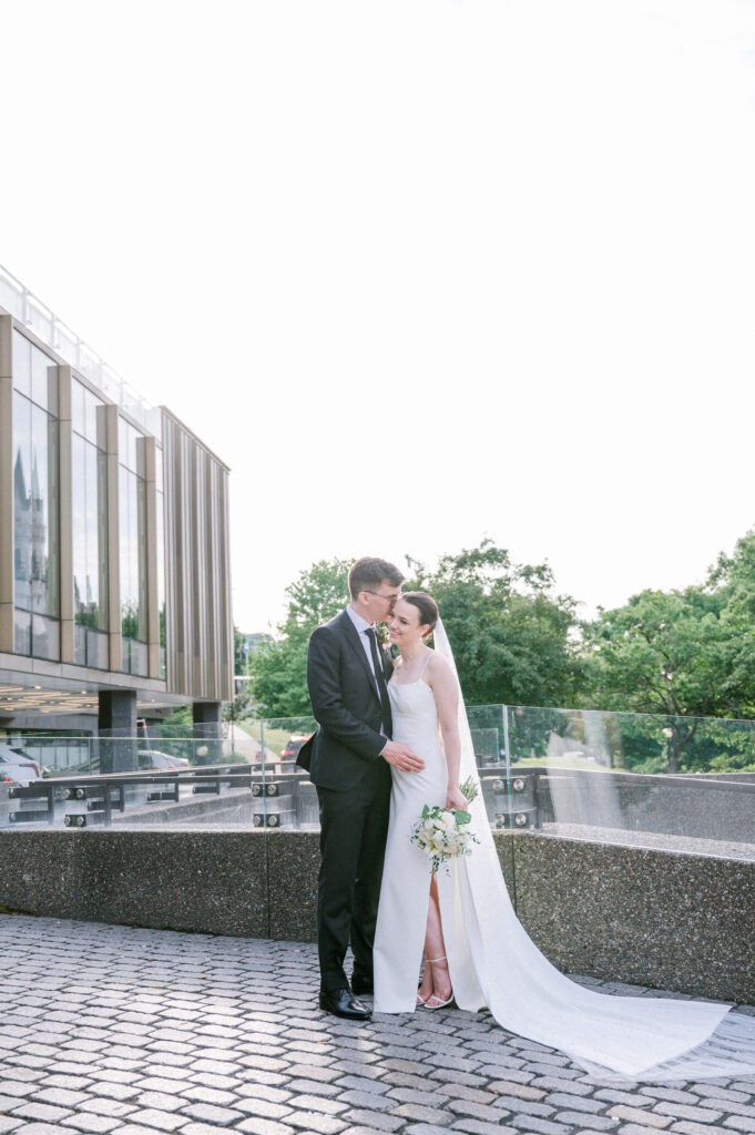 Wedding portraits overlooking the Rideau Canal in Ottawa, steps from the Fairmont Château Laurier — photographed by Emma Haidar