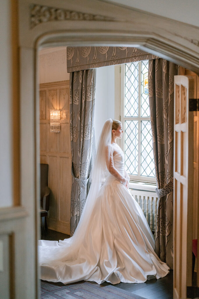 Bride getting ready in a suite at the Fairmont Château Laurier, Ottawa —
wedding photography by Emma Haidar