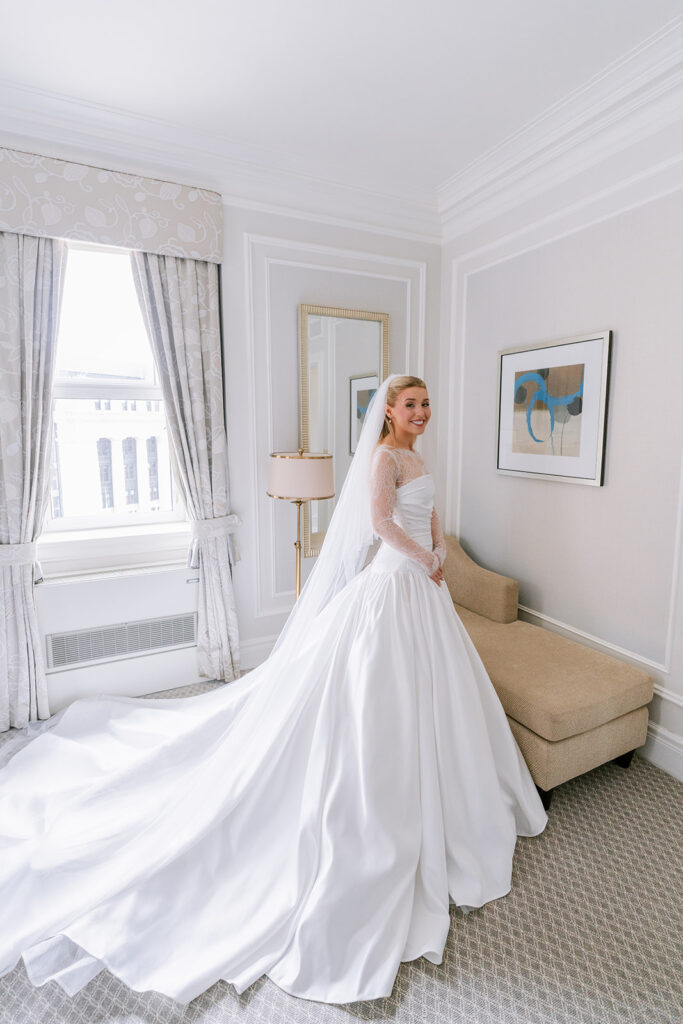Bride getting ready in a suite at the Fairmont Château Laurier, Ottawa —
wedding photography by Emma Haidar