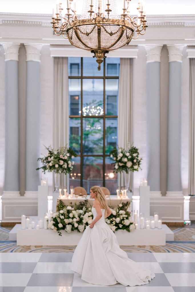 Bride at the sweetheart table in a ballroom at the Fairmont Château Laurier, Ottawa, planned by Erica Irwin — photographed by Emma Haidar